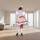 A woman modeling a white and red floral costume dress from the back, featuring puffed sleeves, a red waist sash, white knee-high socks, and black heels, set against a plain white background.